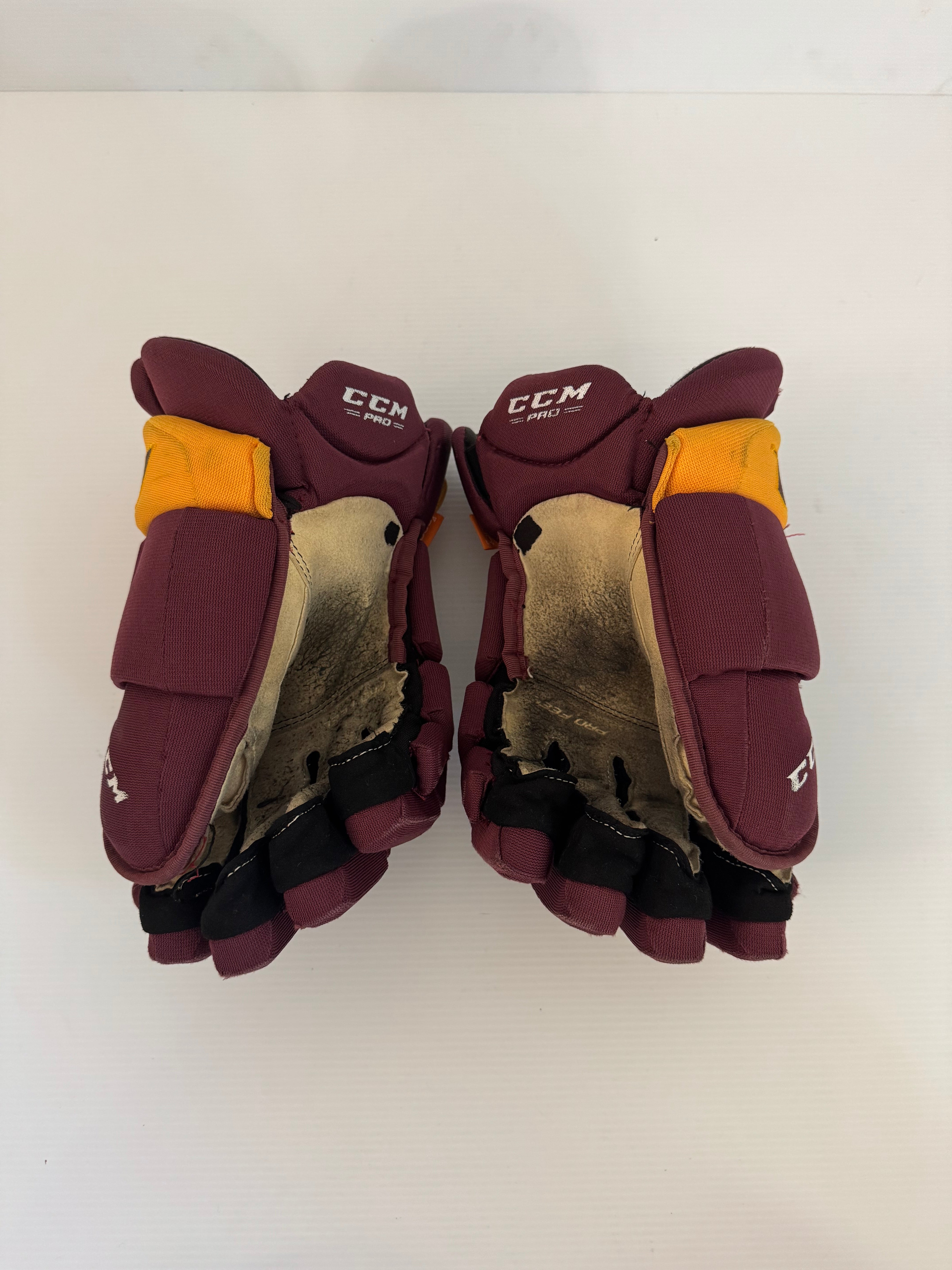 Used CCM HGPJS Senior 15" Pro Stock Hockey Gloves – Maroon/Gold (NCAA)