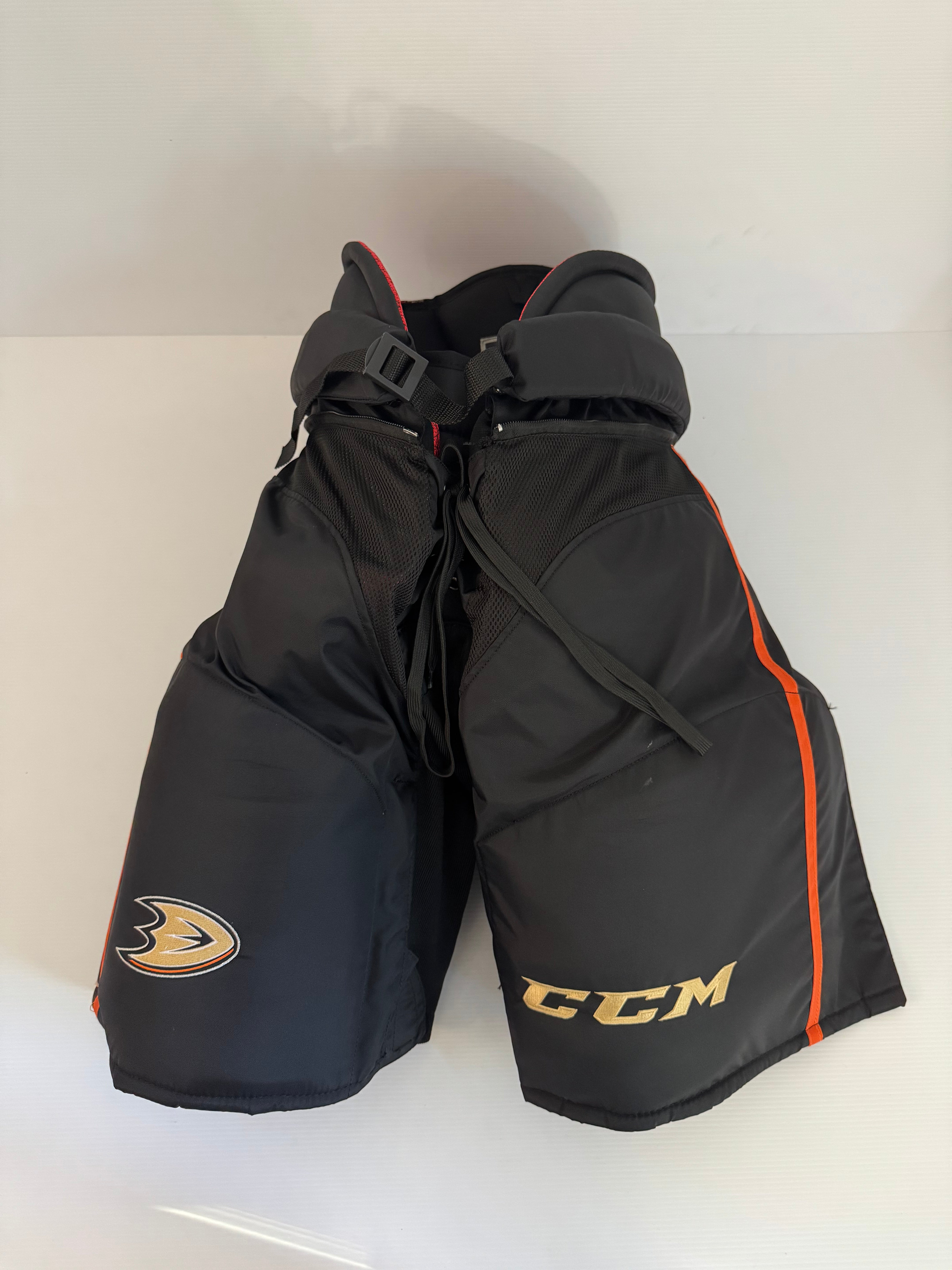 Like New CCM HP45 Senior Large Pro Stock Anaheim Ducks Hockey Pants – Black/Orange/Gold (NHL)