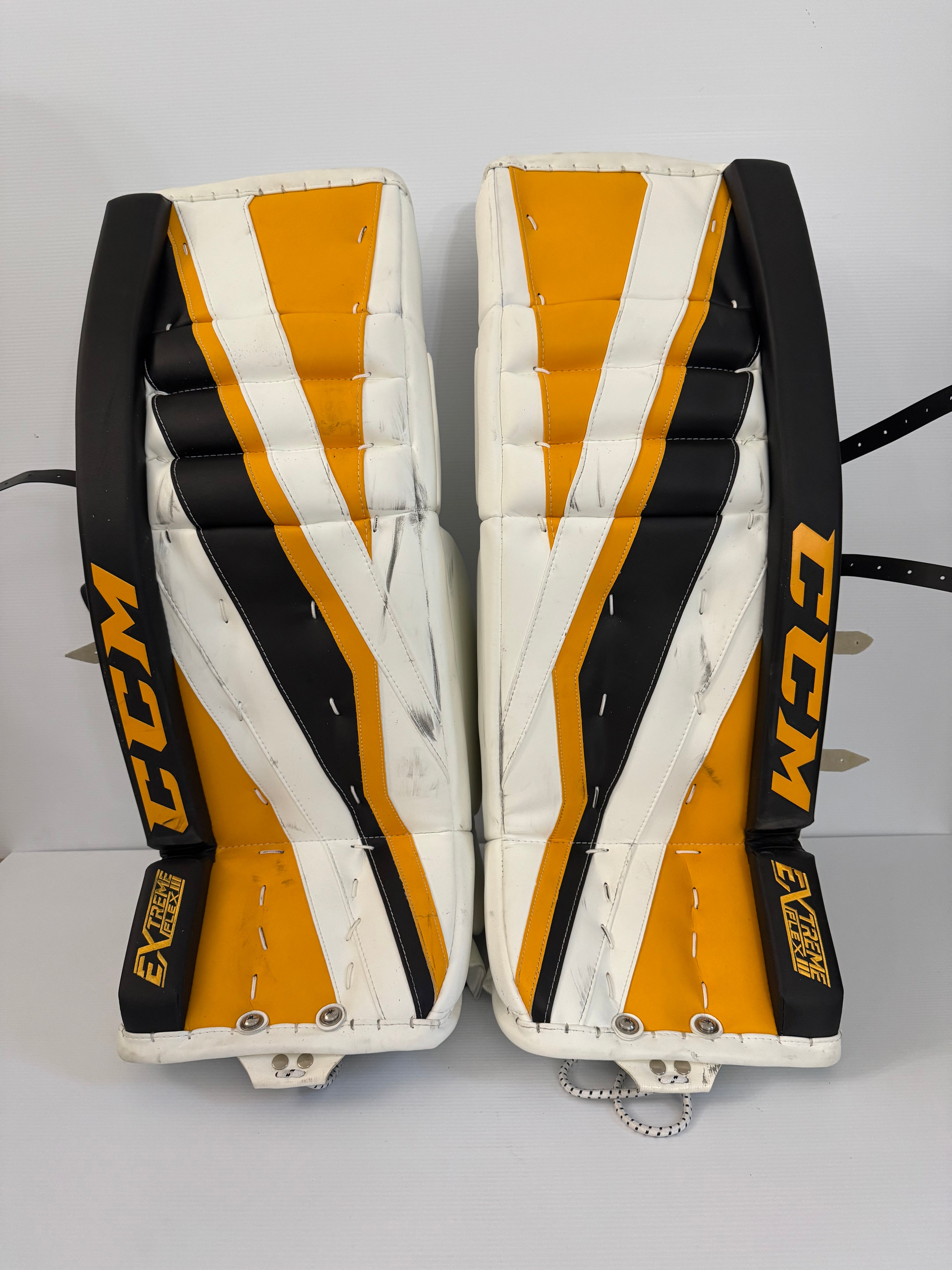 Used CCM Pro Stock Extreme Flex III Leg Pads 32+1 – Black/Gold/White (NCAA)